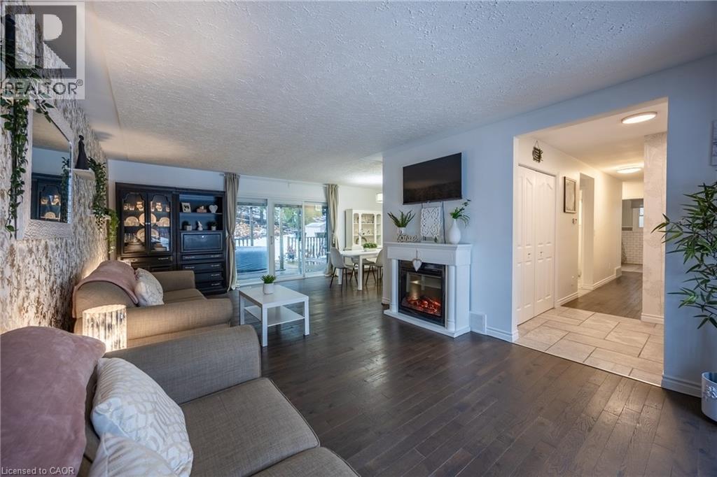 70 Berkley Crescent, Simcoe, ON - Indoor Photo Showing Living Room With Fireplace