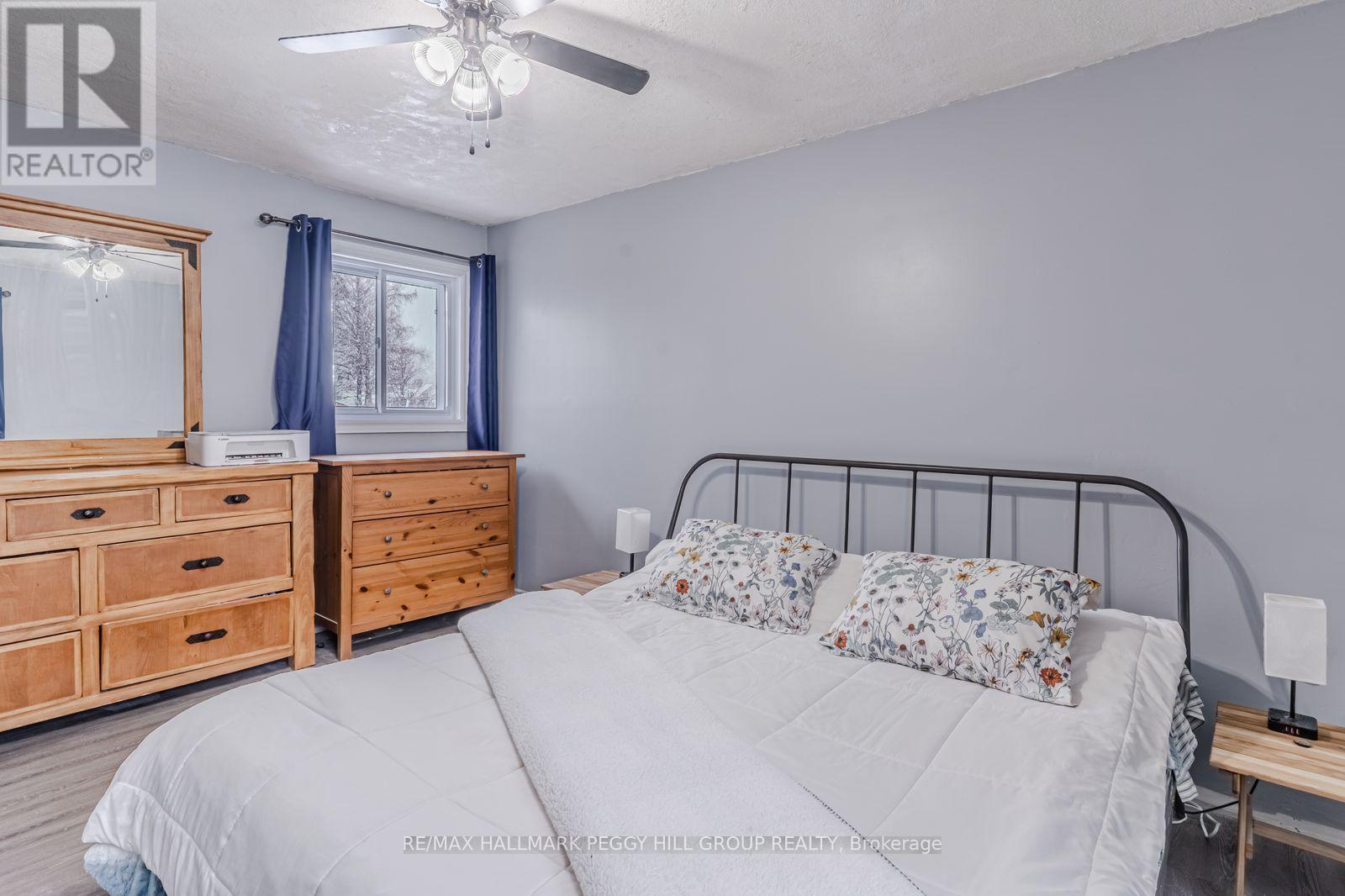 90 Queen Street E, Springwater, ON - Indoor Photo Showing Bedroom