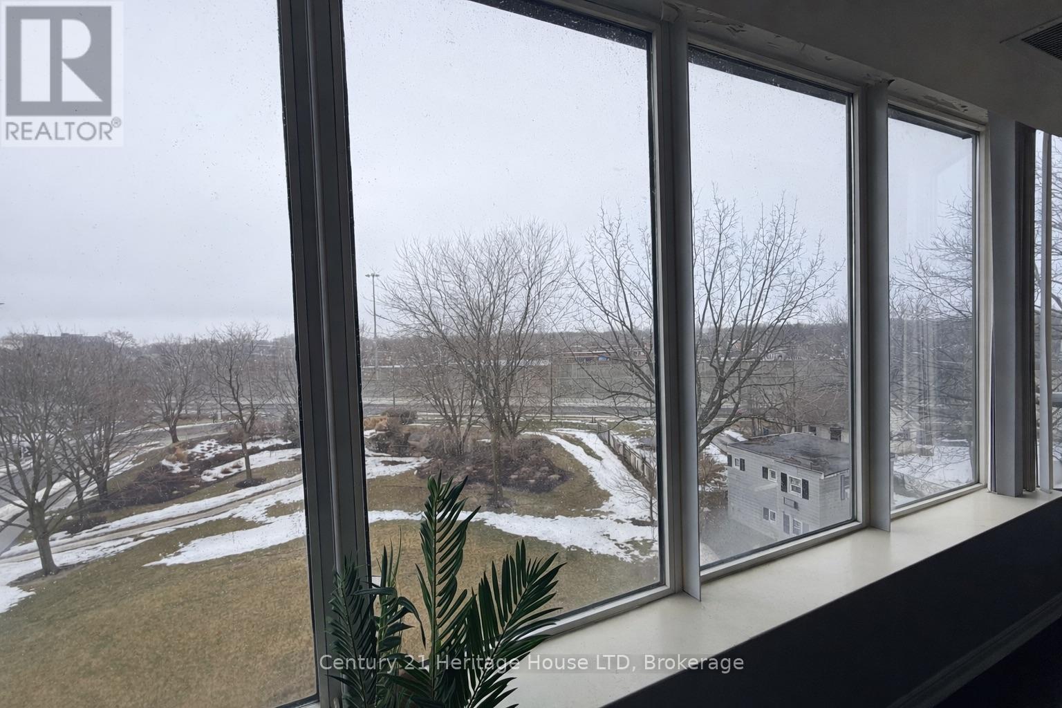 Large dining room window - 504 - 81 Scott Street, St. Catharines (Lakeport), ON - Indoor Photo Showing Other Room