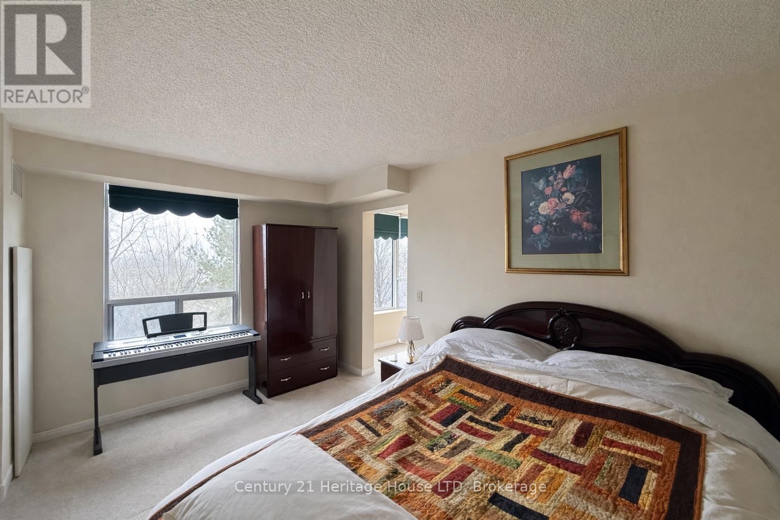 Primary Bedroom - 504 - 81 Scott Street, St. Catharines (Lakeport), ON - Indoor Photo Showing Bedroom