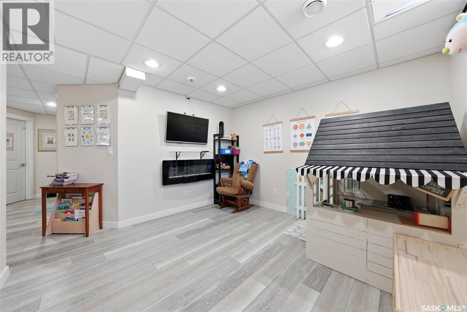 417 Golden Willow Way, Warman, SK - Indoor Photo Showing Other Room With Fireplace