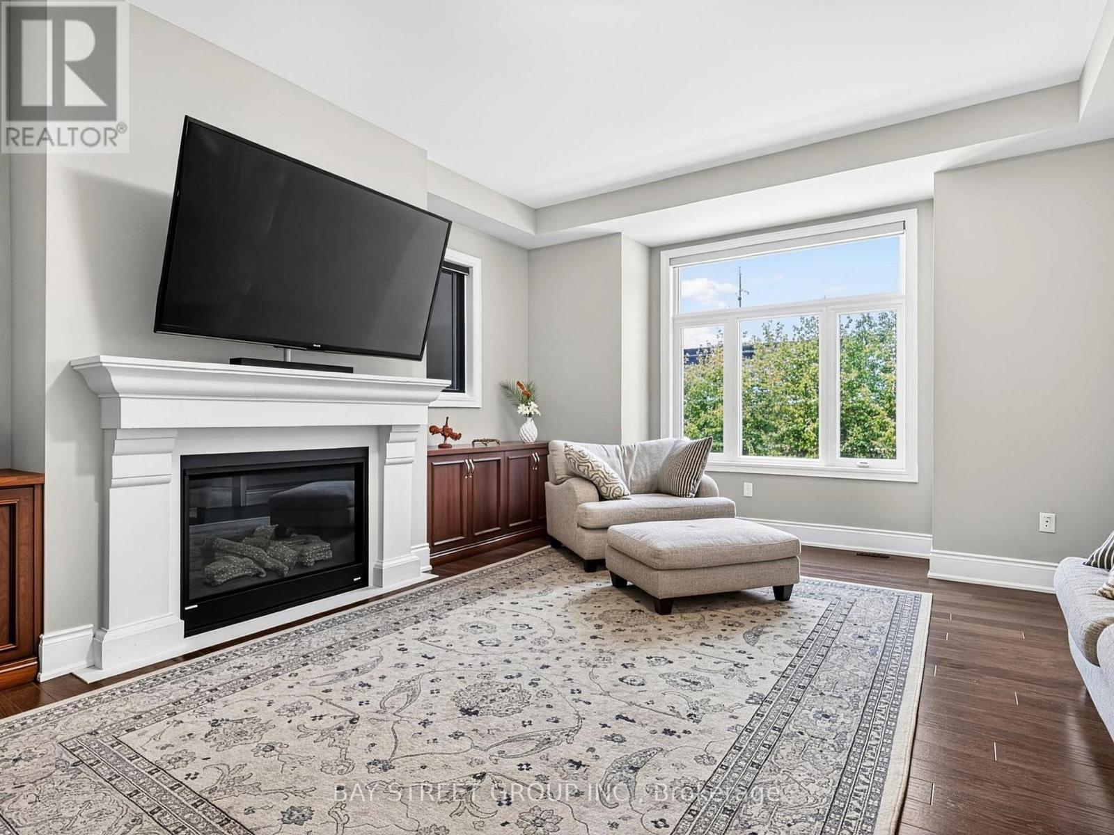 Family Room with Gas Fireplace - 39 Cairns Gate, King, ON - Indoor Photo Showing Living Room With Fireplace