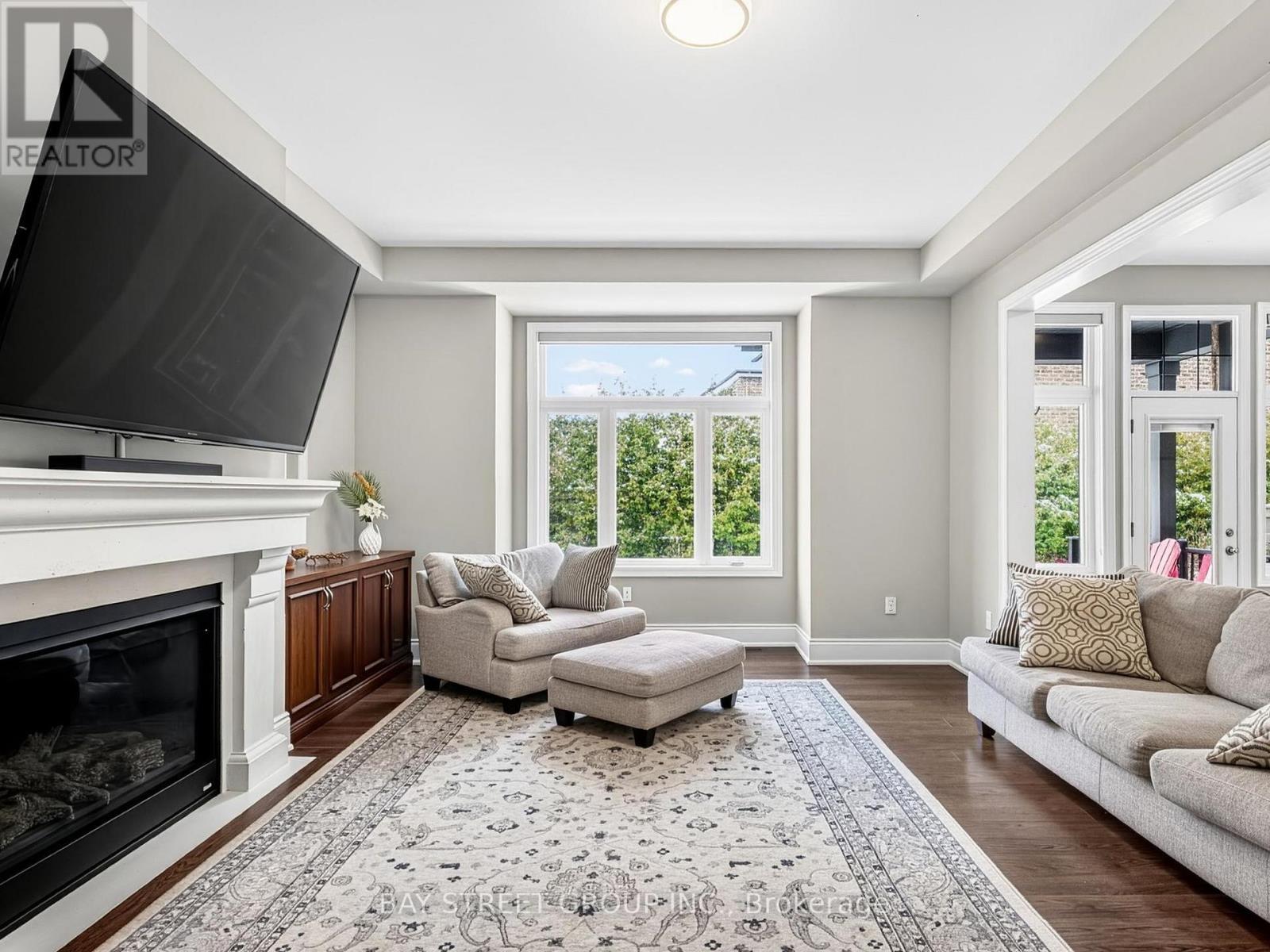Family Room with Gas Fireplace - 39 Cairns Gate, King, ON - Indoor Photo Showing Living Room With Fireplace