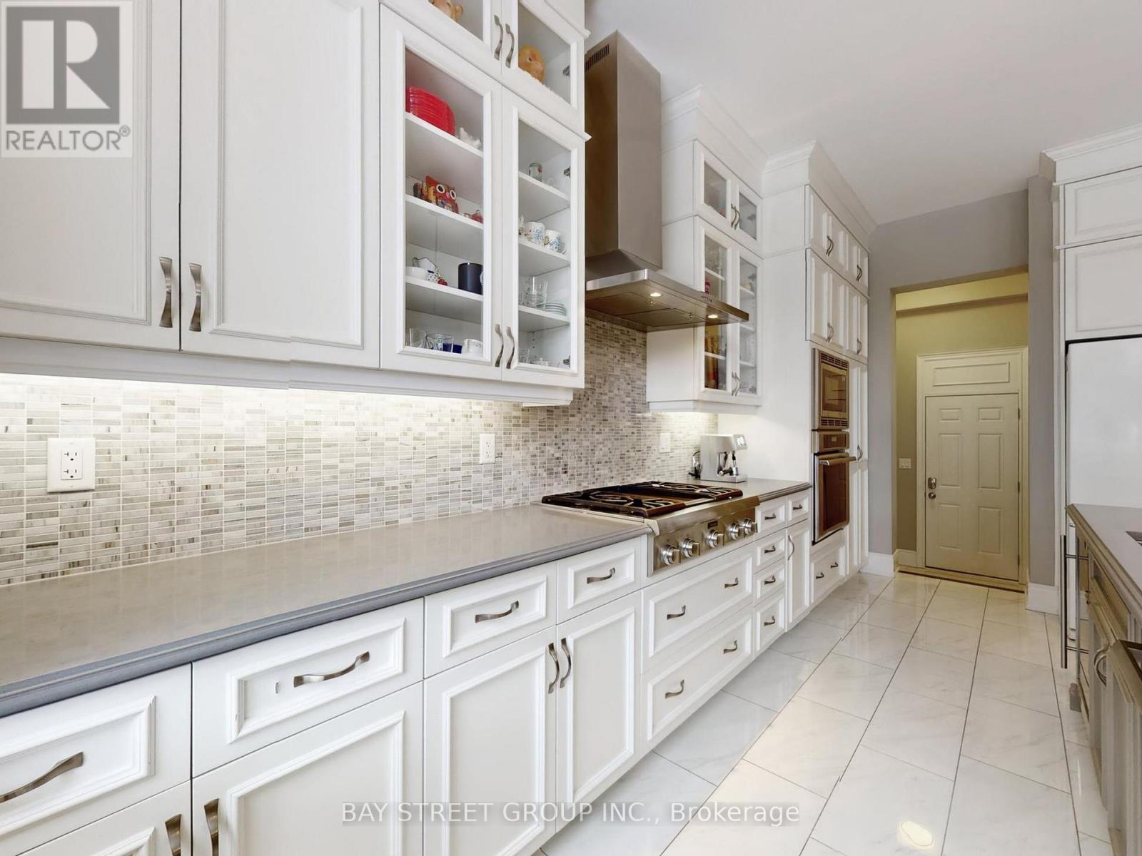 Custom Cabinetry with Tile Backsplash - 39 Cairns Gate, King, ON - Indoor Photo Showing Kitchen With Upgraded Kitchen