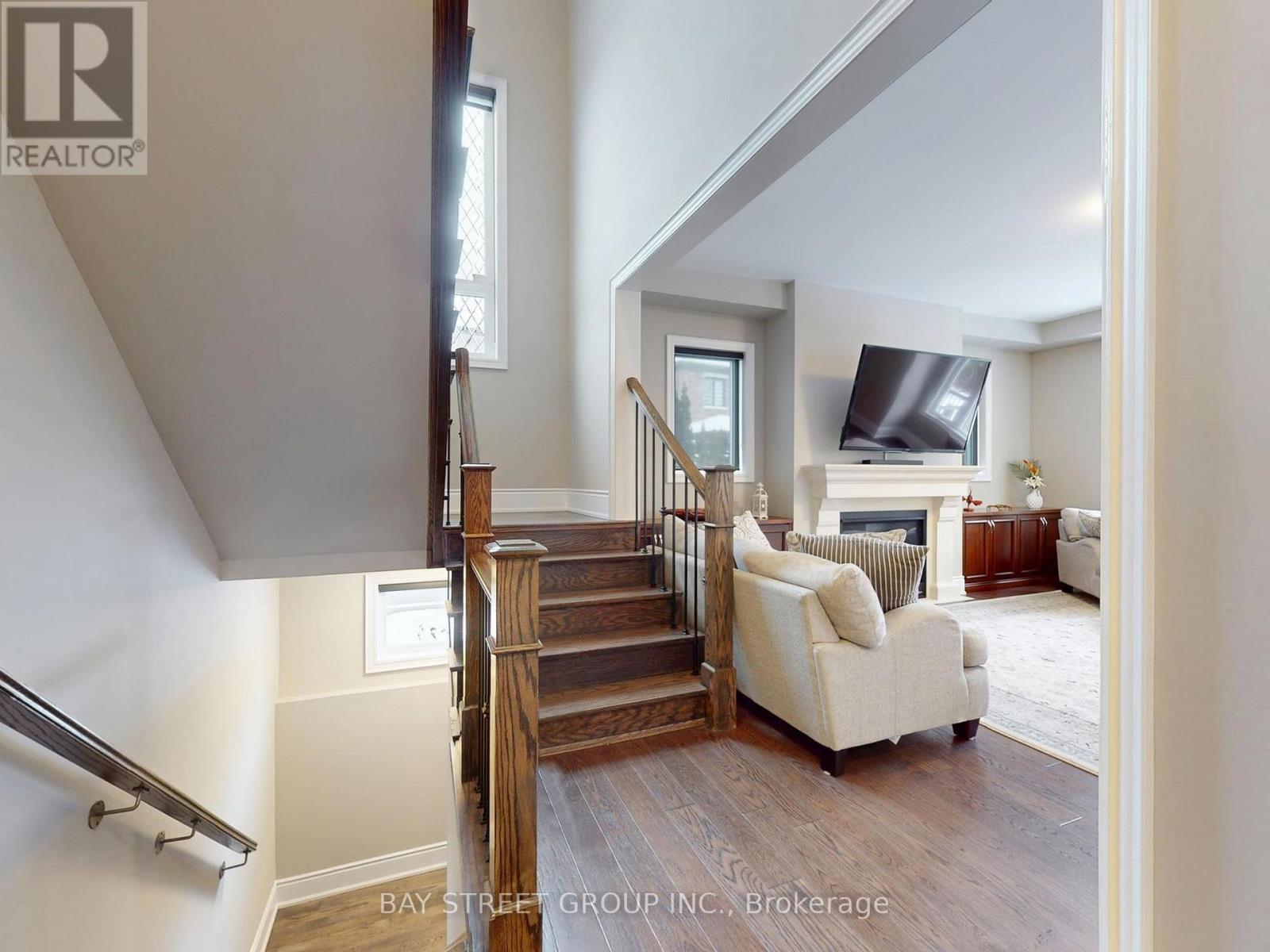 Open Staircase to Main Living Area - 39 Cairns Gate, King, ON - Indoor With Fireplace