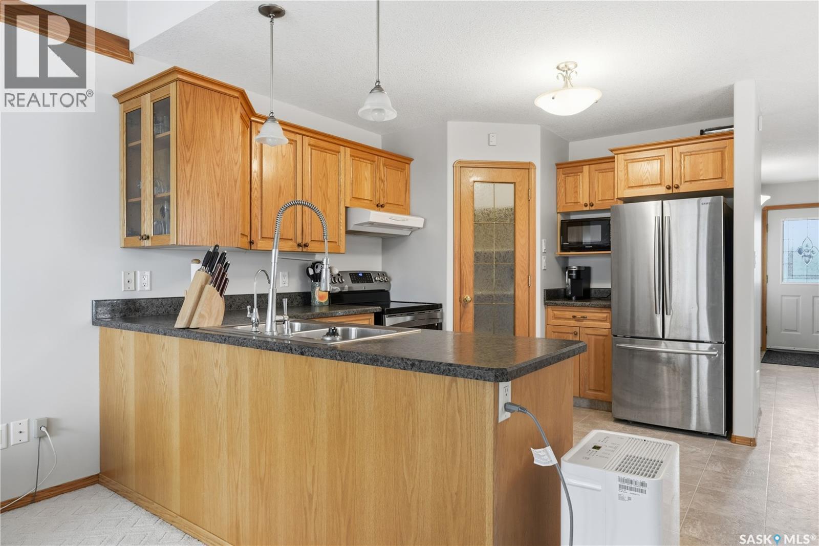 1134 Degelman Drive, Regina, SK - Indoor Photo Showing Kitchen With Double Sink