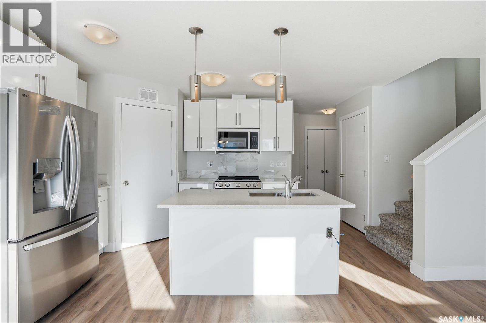 111 Stromberg Crescent, Saskatoon, SK - Indoor Photo Showing Kitchen With Double Sink With Upgraded Kitchen