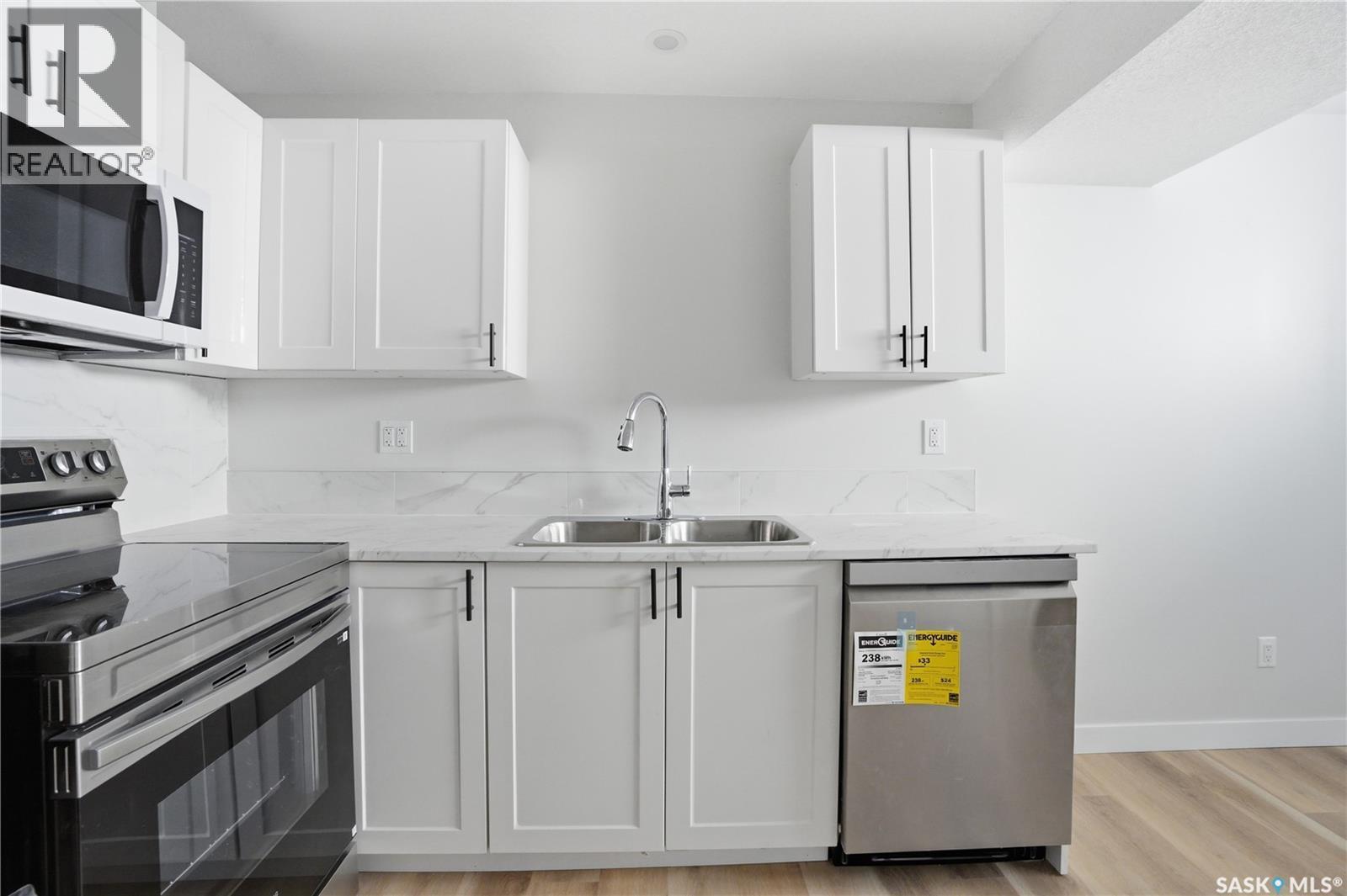 111 Stromberg Crescent, Saskatoon, SK - Indoor Photo Showing Kitchen With Double Sink