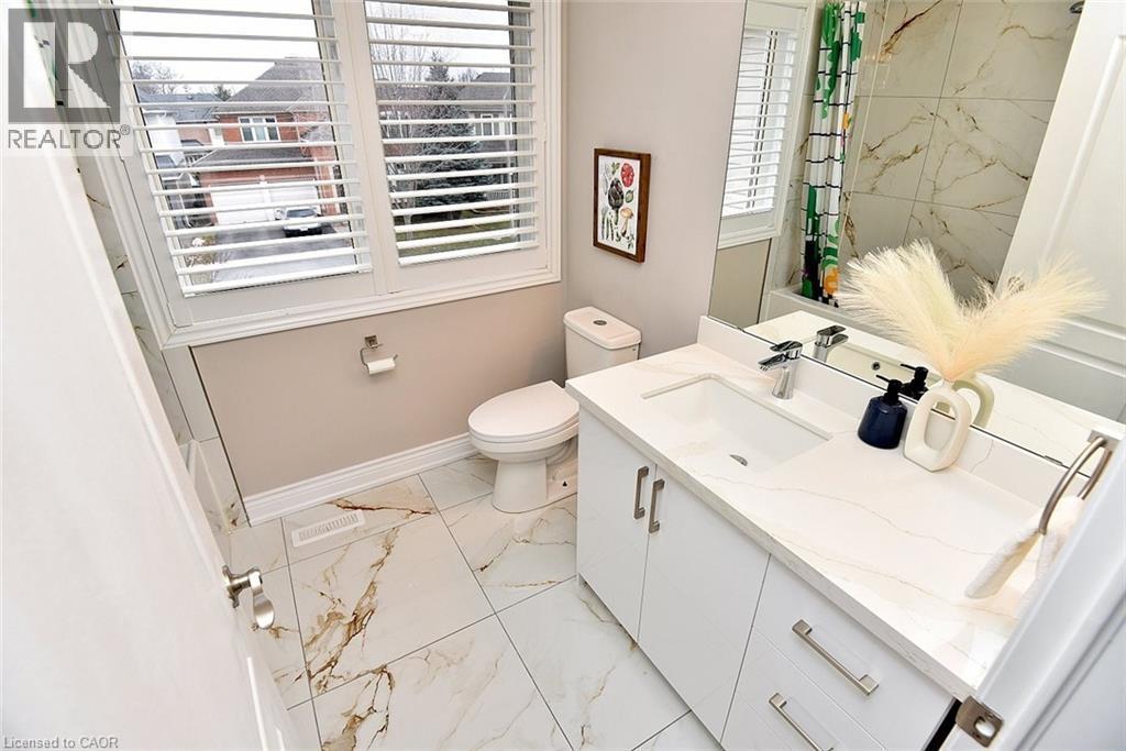 Bathroom featuring vanity, a shower with curtain, and light marble finish floors - 5109 Blue Spruce Avenue, Burlington, ON - Indoor Photo Showing Bathroom