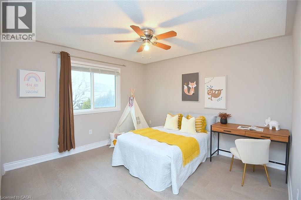 Bedroom with light wood-type flooring and ceiling fan - 5109 Blue Spruce Avenue, Burlington, ON - Indoor