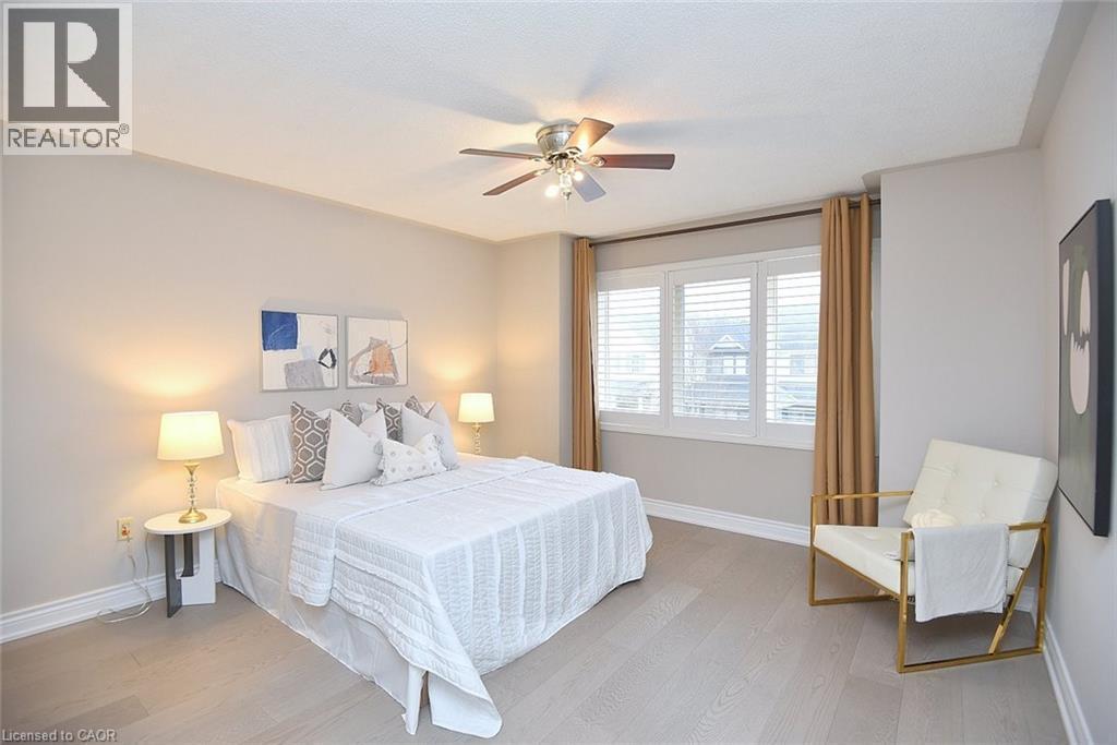 Bedroom with light wood-style floors and ceiling fan - 5109 Blue Spruce Avenue, Burlington, ON - Indoor Photo Showing Bedroom