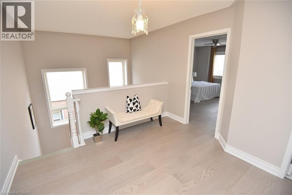 Hallway featuring light wood-style floors and baseboards - 5109 Blue Spruce Avenue, Burlington, ON - Indoor Photo Showing Other Room