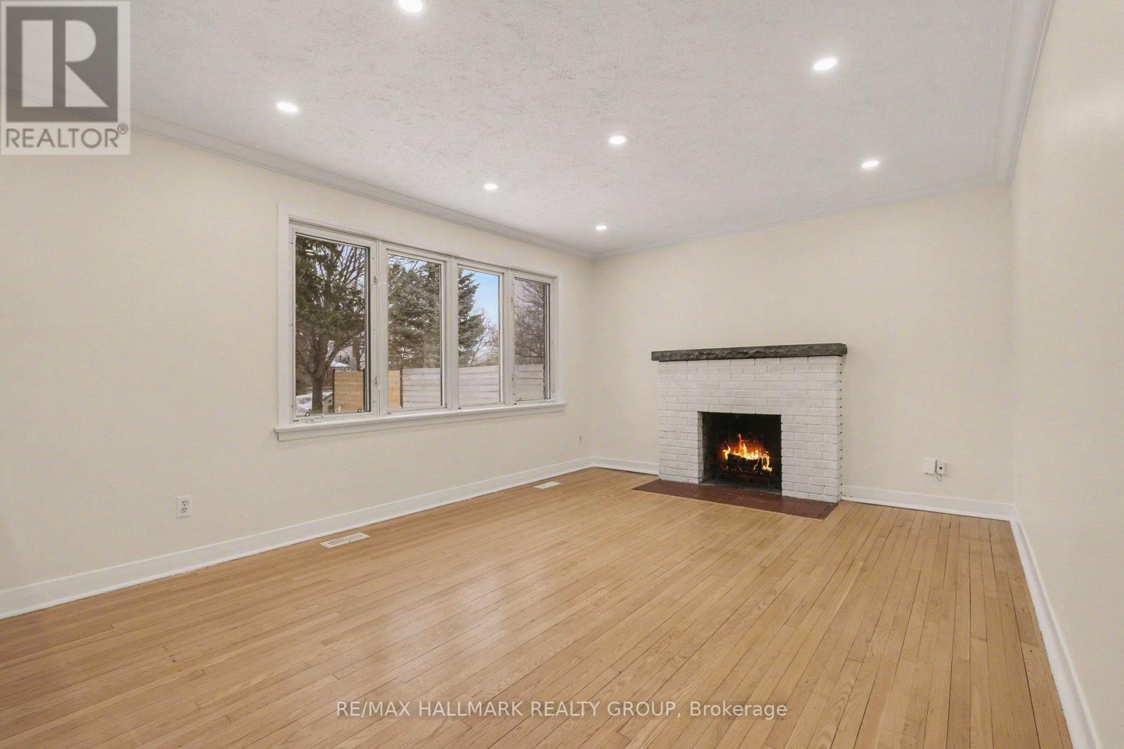 1299 Evans Boulevard, Ottawa, ON - Indoor Photo Showing Living Room With Fireplace