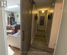 Centre Hallway with Barn Style Door to Den / Offic -