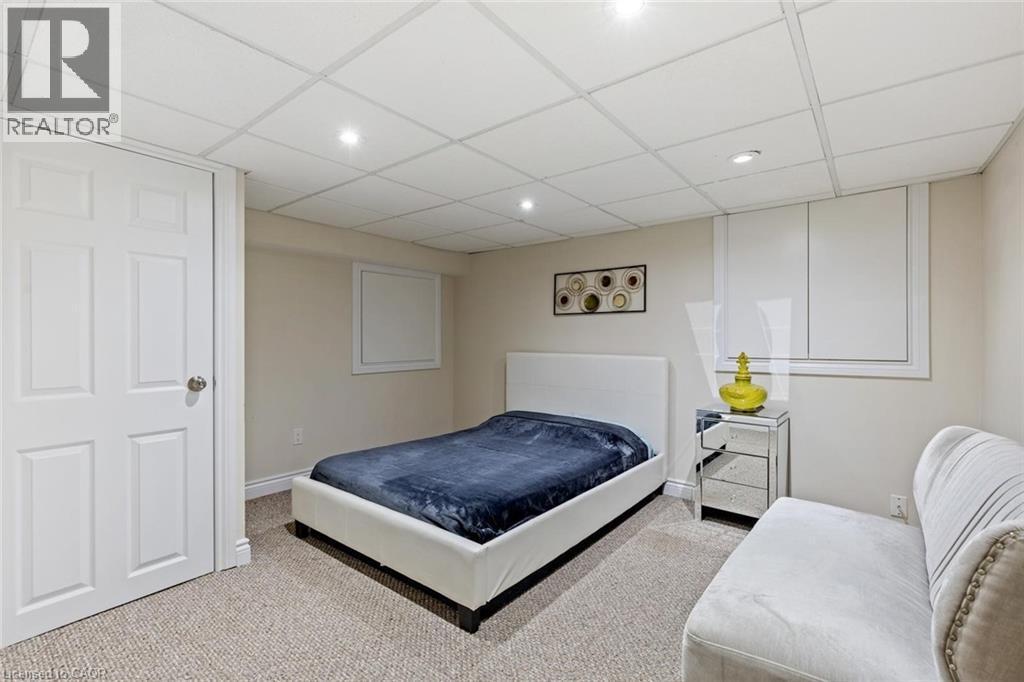 Carpeted bedroom featuring a paneled ceiling - 1073 North Service Road, Hamilton, ON - Indoor Photo Showing Bedroom