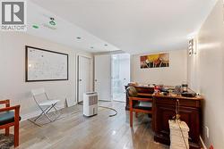 Office space featuring light wood-type flooring -