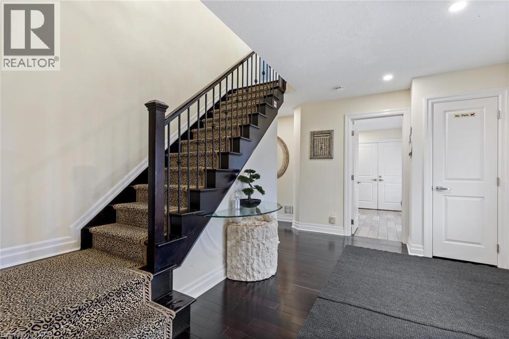 Stairway with hardwood / wood-style floors - 1073 North Service Road, Hamilton, ON - Indoor Photo Showing Other Room
