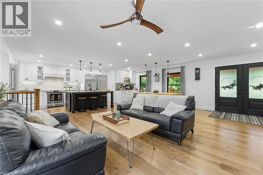 Living room featuring light wood finished floors, french doors, recessed lighting, and ceiling fan - 115 Lakeshore Road, Port Burwell, ON - Indoor Photo Showing Living Room