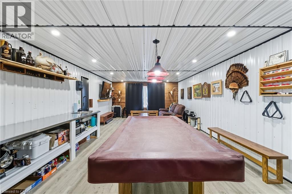 Rec room featuring pool table, light wood-style floors, and metal wall - 115 Lakeshore Road, Port Burwell, ON - Indoor