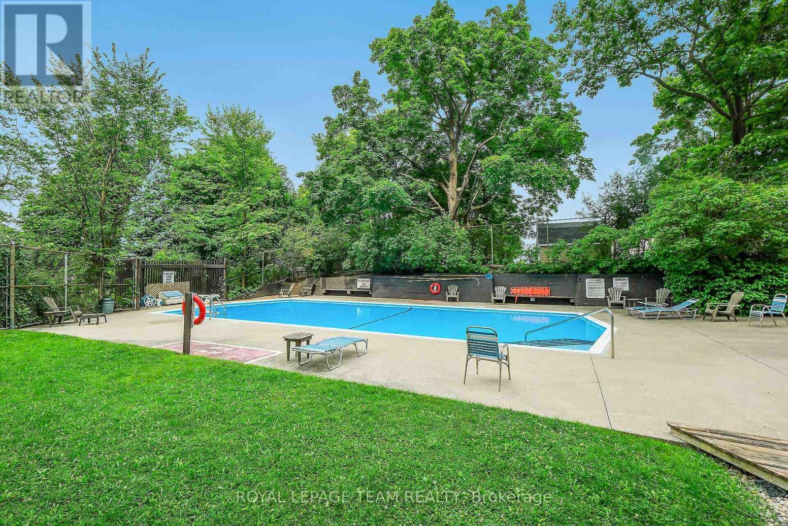 Outdoor Pool - 708 - 20 Chesterton Drive, Ottawa, ON - Outdoor With In Ground Pool With Backyard