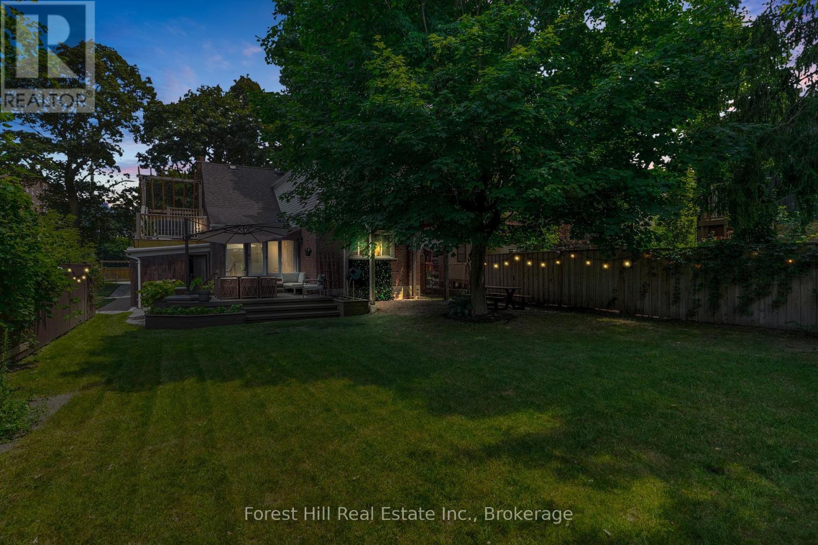 Photo digitally enhanced with twilight effects - 161 Herbert Street, Waterloo, ON - Outdoor With Deck Patio Veranda