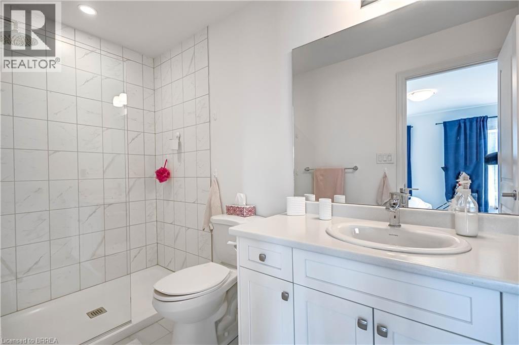 Full bath with vanity and tiled shower - 29 Bellhouse Avenue, Brantford, ON - Indoor Photo Showing Bathroom