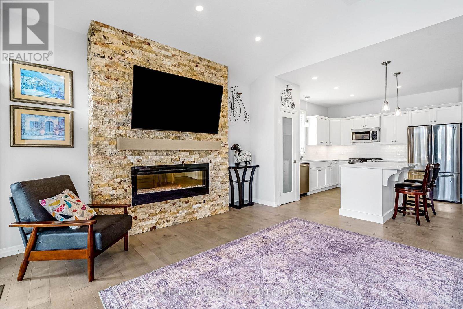 52 Charter Creek Court, St. Thomas, ON - Indoor Photo Showing Other Room With Fireplace