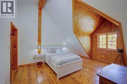 Primary bedroom with vaulted ceilings and walk-in closet -