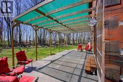 Covered rear patio with loads of room for outdoor dining and lounging -