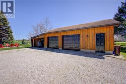 The 24’ x 30’ 2 car garage includes a wood stove and ample space for cars, and toys. A 24’ x 14’ lean-to adds even more room for storage -
