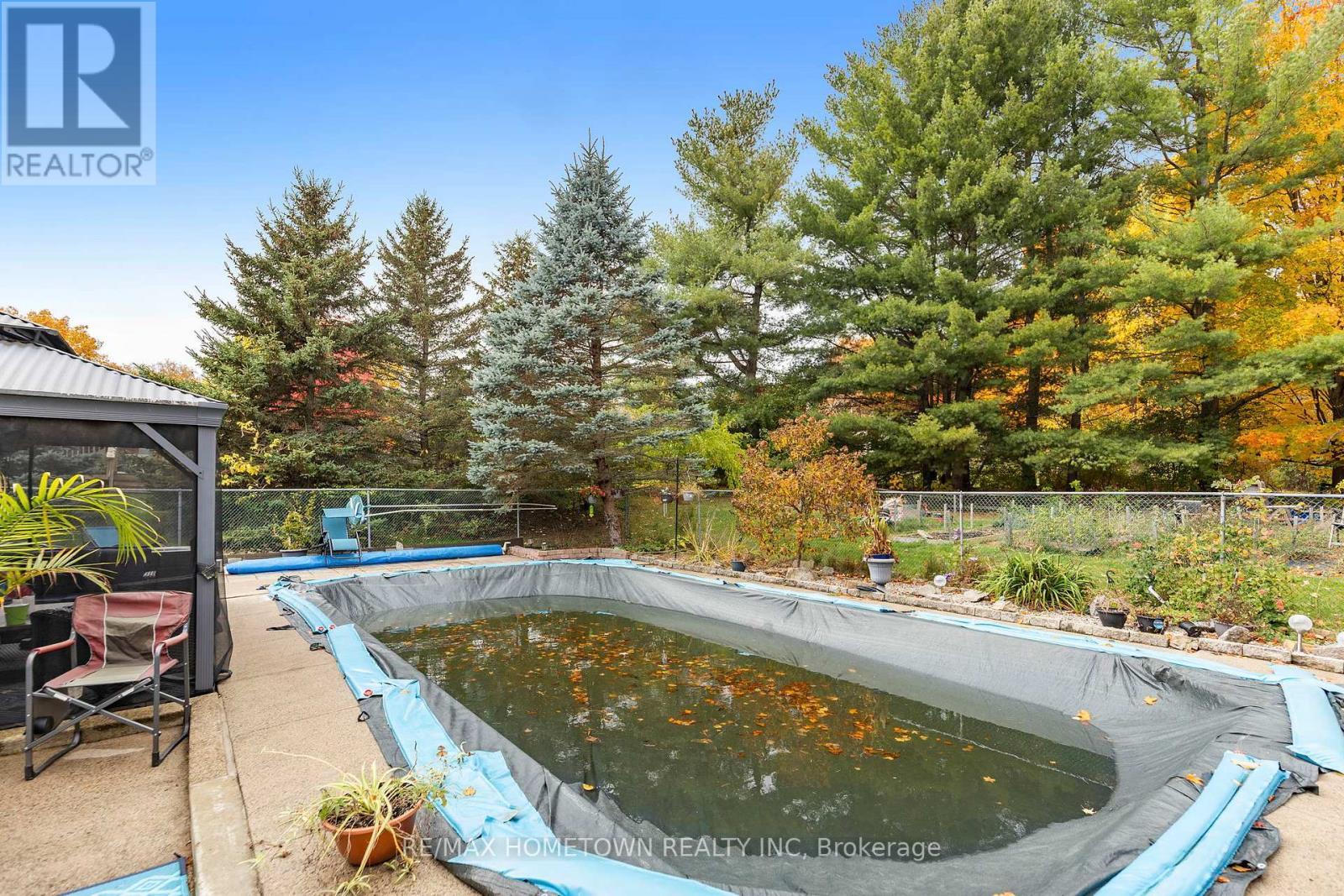 4 Meikle Drive, Augusta, ON - Outdoor With In Ground Pool With Backyard
