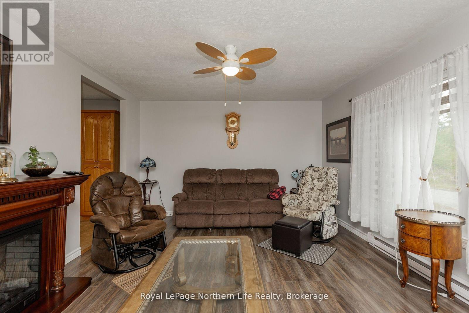 91 Oak Street, Unorganized Townships (Thorne), ON - Indoor Photo Showing Living Room With Fireplace
