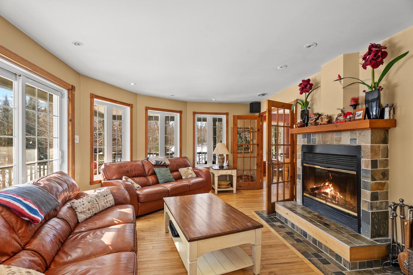 Salon - 38 Imp. Denise, Lac-Supérieur, QC - Indoor Photo Showing Living Room With Fireplace