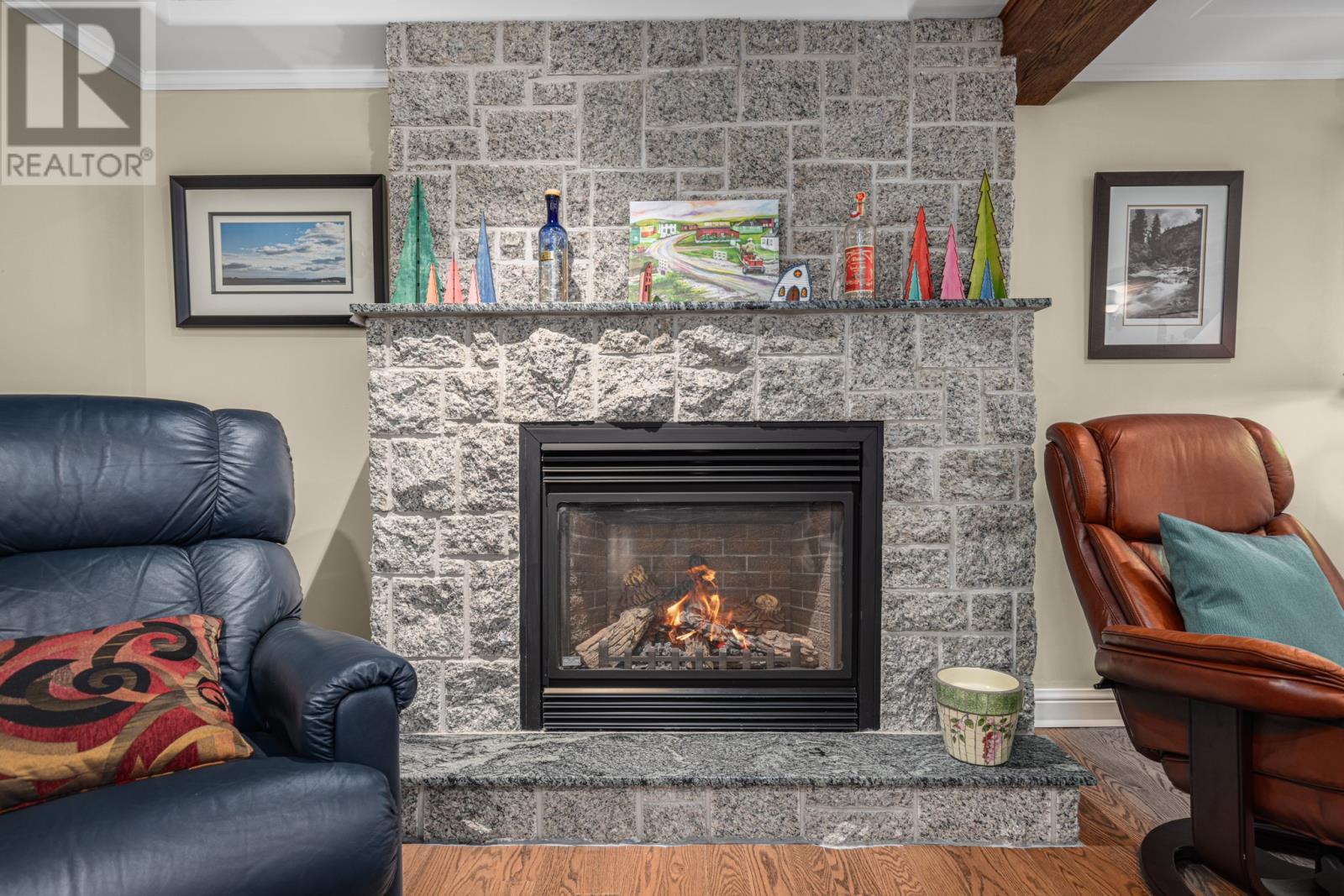 Rec-room/ Lower lever - 3 Topsail Heights, Conception Bay South, NL - Indoor Photo Showing Living Room With Fireplace