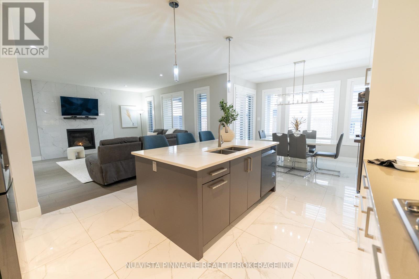 3354 Mersea Street, London South (South V), ON - Indoor Photo Showing Kitchen With Fireplace With Double Sink
