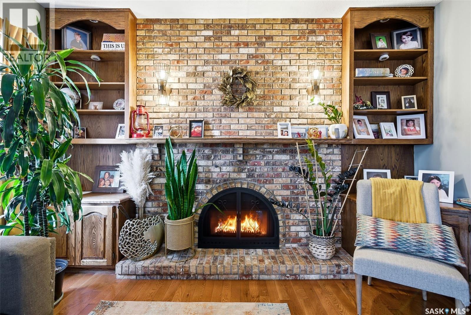 2402 Truesdale Drive, Regina, SK - Indoor Photo Showing Living Room With Fireplace