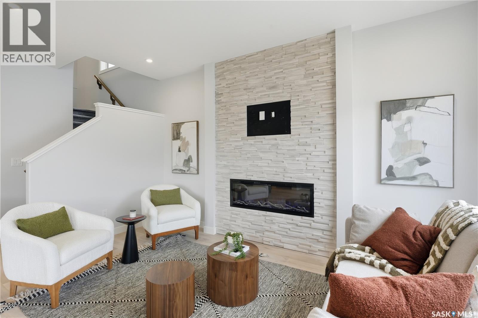 5545 Kennett Square, Regina, SK - Indoor Photo Showing Living Room With Fireplace