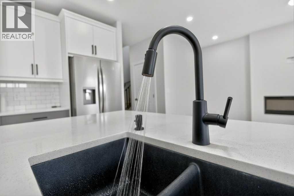268 Cornerbrook Road Ne, Calgary, AB - Indoor Photo Showing Kitchen With Double Sink
