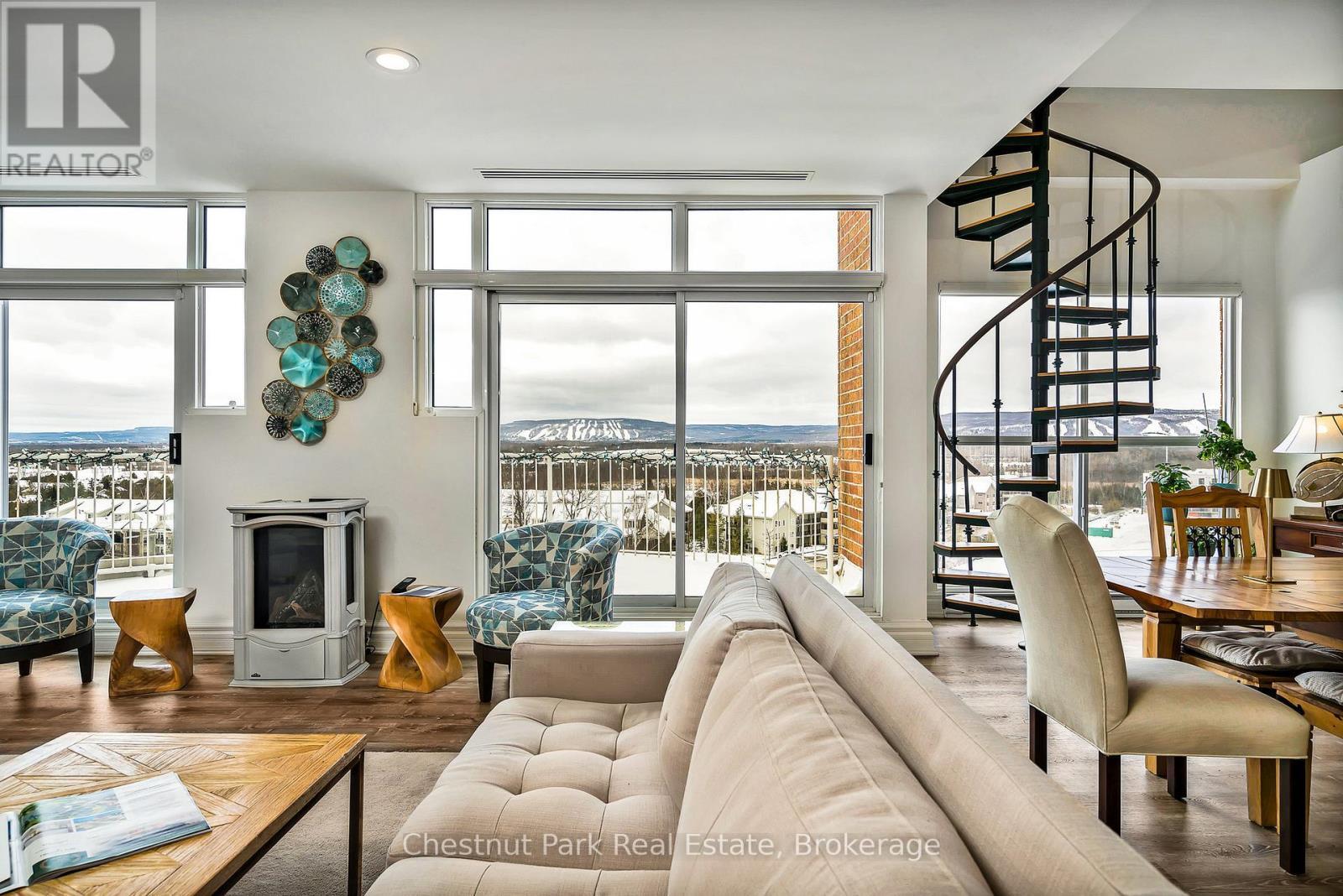 Views of the Escarpment and ski hills - 1001 - 24 Ramblings Way, Collingwood, ON - Indoor Photo Showing Living Room
