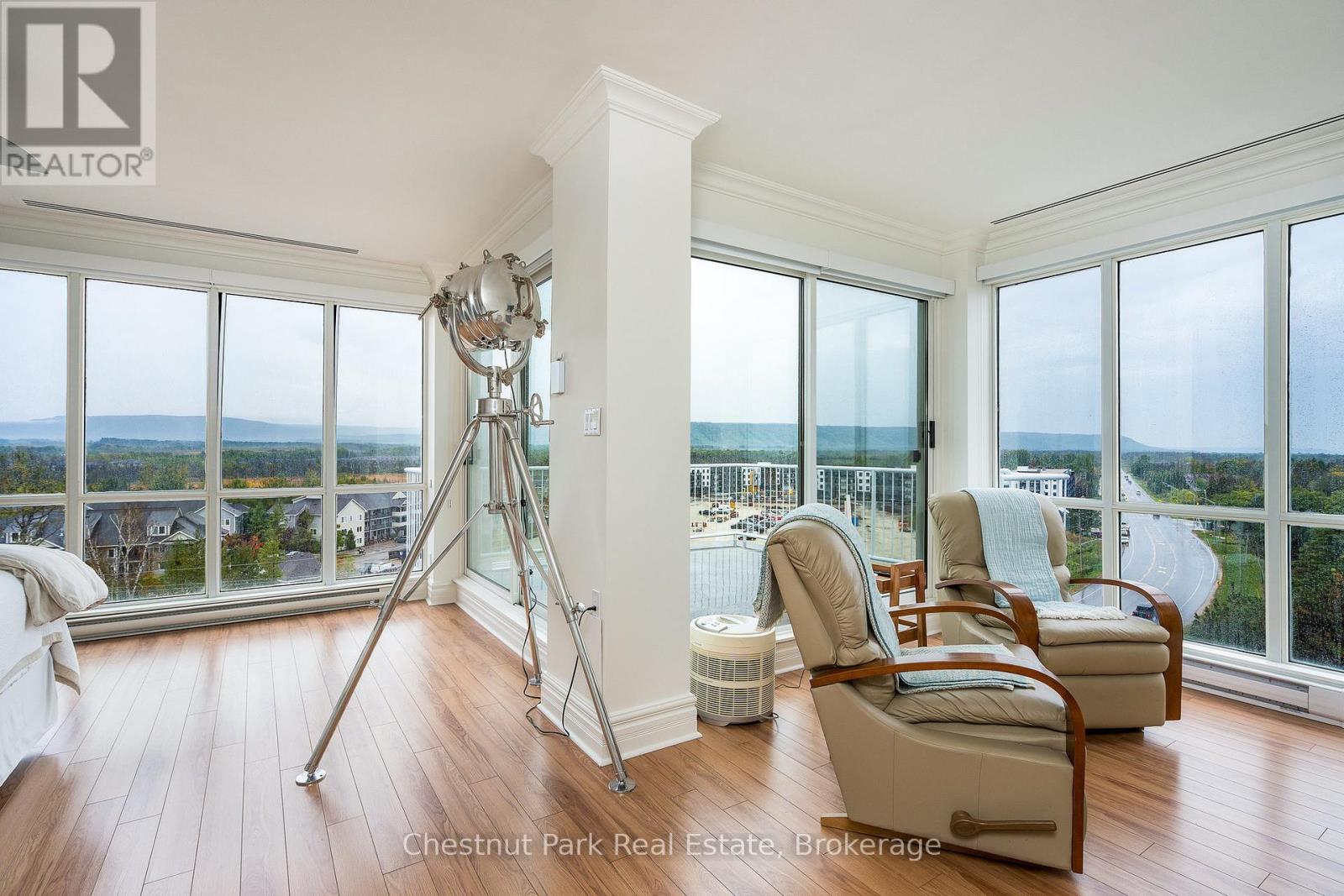 Primary bedroom with expansive views - 1001 - 24 Ramblings Way, Collingwood, ON - Indoor Photo Showing Living Room