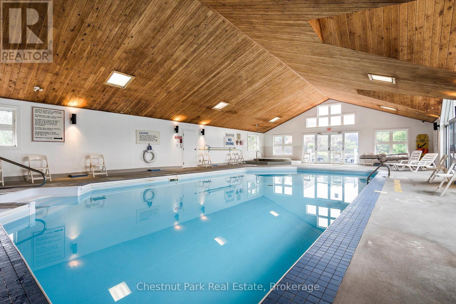 Indoor pool and hot tub in rec centre - 1001 - 24 Ramblings Way, Collingwood, ON - Indoor Photo Showing Other Room With In Ground Pool