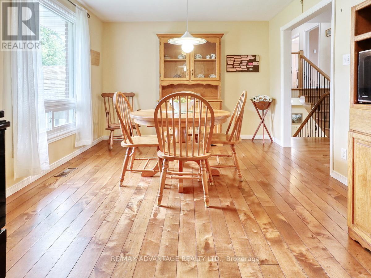 17248 Wyton Drive, Thames Centre, ON - Indoor Photo Showing Dining Room With Fireplace