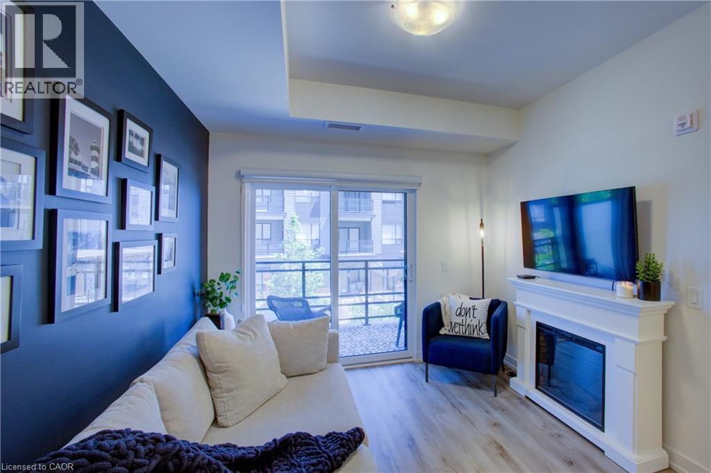 243 Northfield Drive E Unit# 208, Waterloo, ON - Indoor With Fireplace