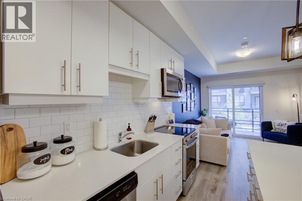 243 Northfield Drive E Unit# 208, Waterloo, ON - Indoor Photo Showing Kitchen With Upgraded Kitchen