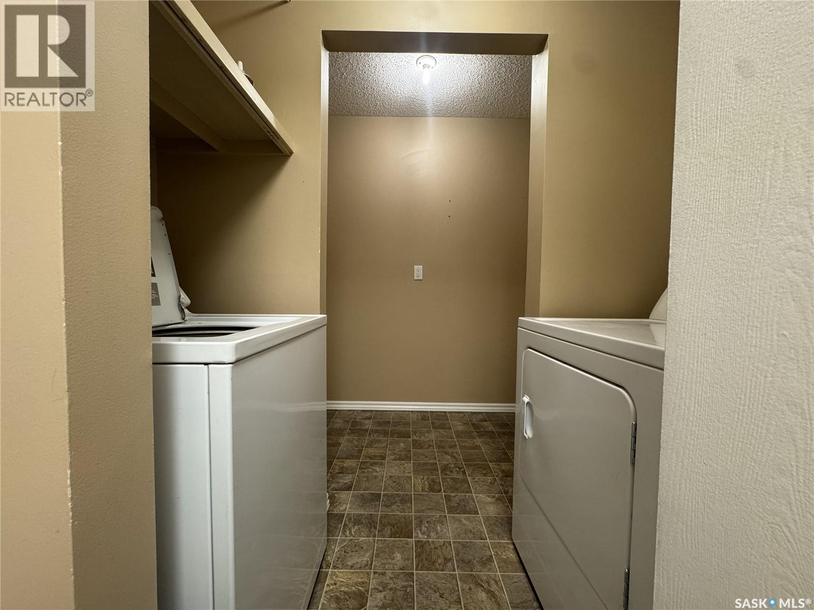 B 64 Nollet Avenue, Regina, SK - Indoor Photo Showing Laundry Room