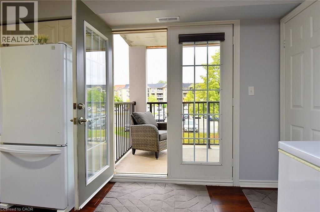Bright and sunny with french doors to private balcony - 1411 Walkers Line Unit# 202, Burlington, ON - Indoor Photo Showing Other Room