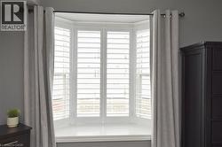 Bay window with California shutters -