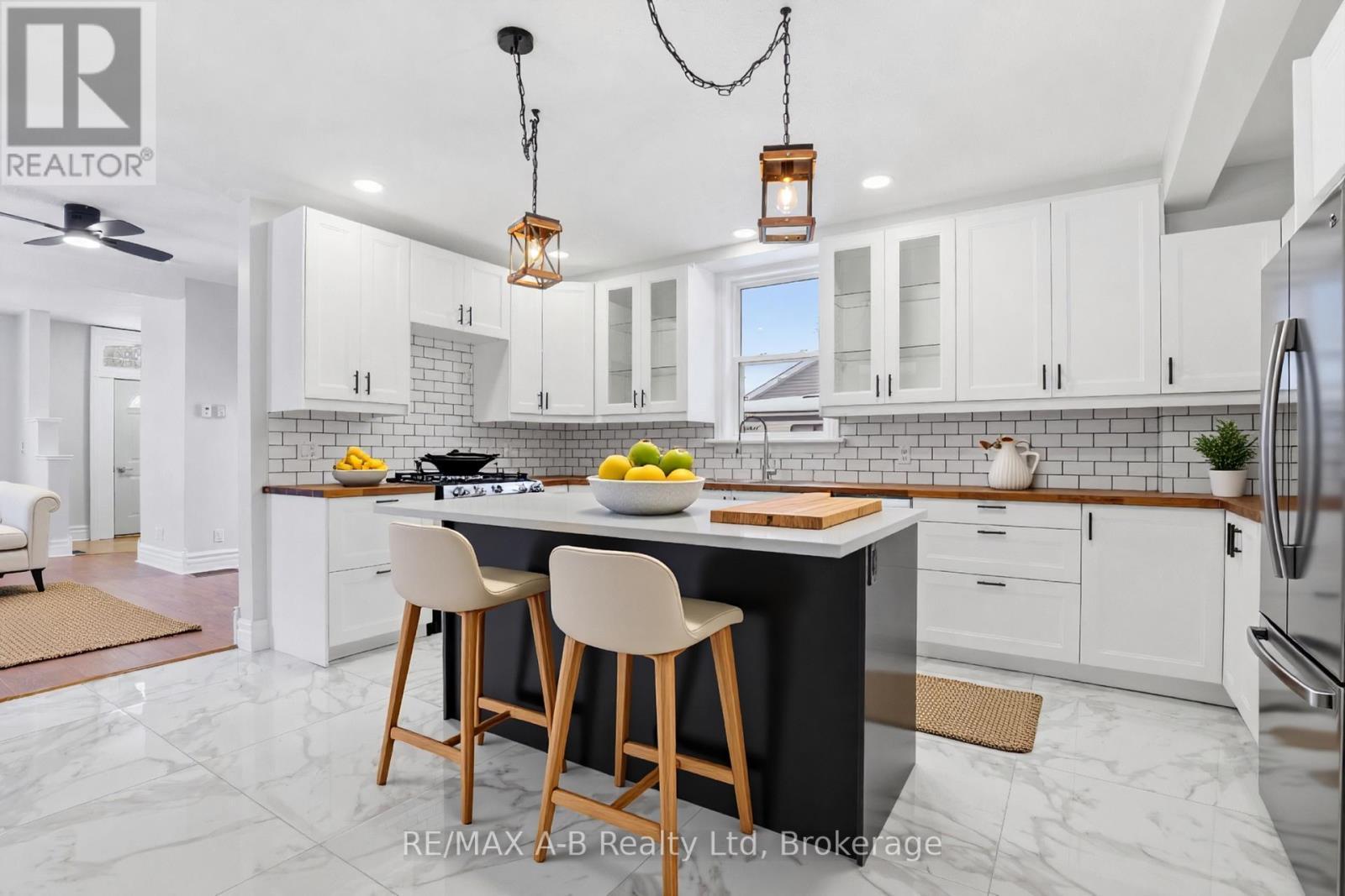 This image has been virtually staged - 307 Nelson Street, Stratford, ON - Indoor Photo Showing Kitchen With Upgraded Kitchen