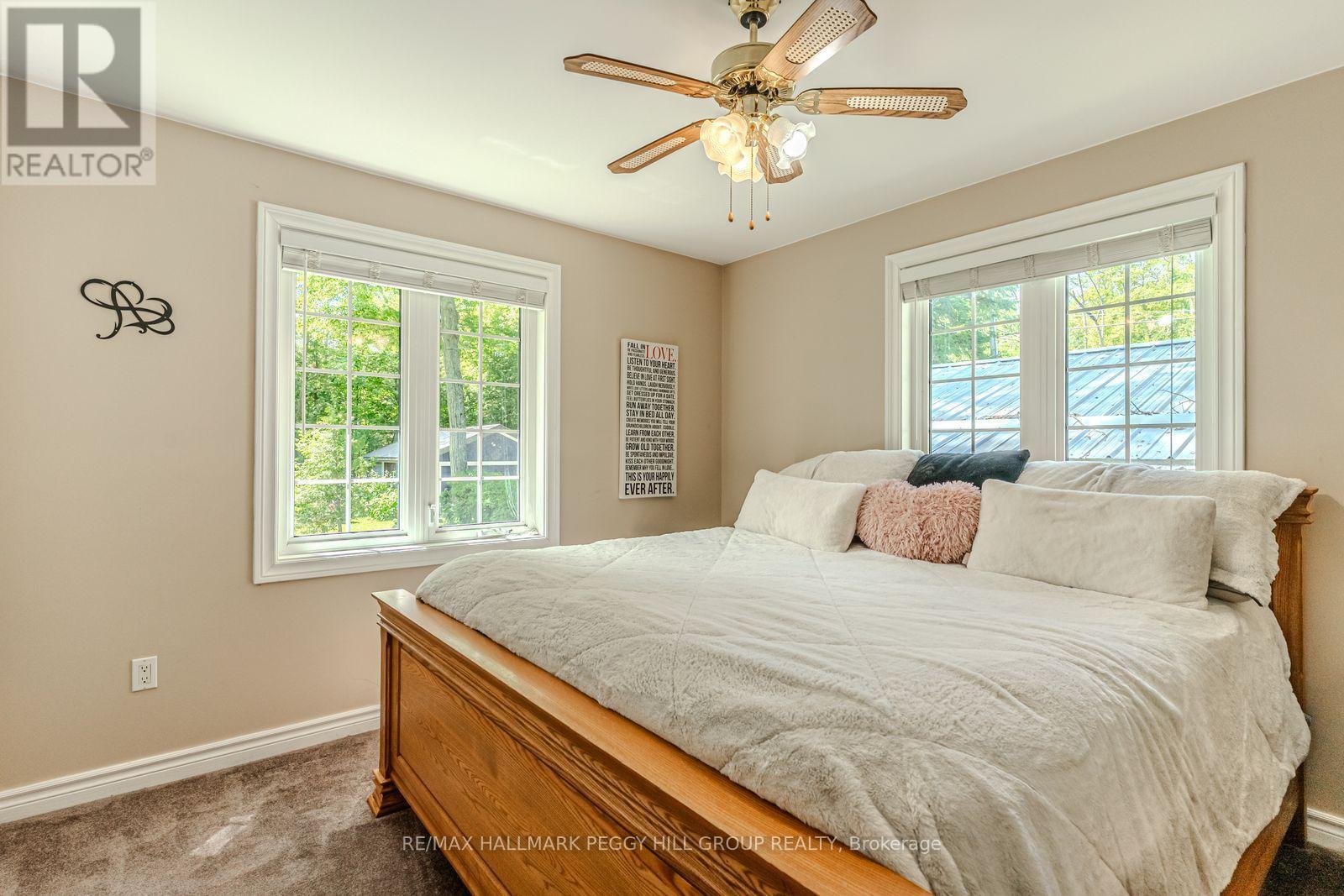 383 Peek-A-Boo Trail, Tiny, ON - Indoor Photo Showing Bedroom