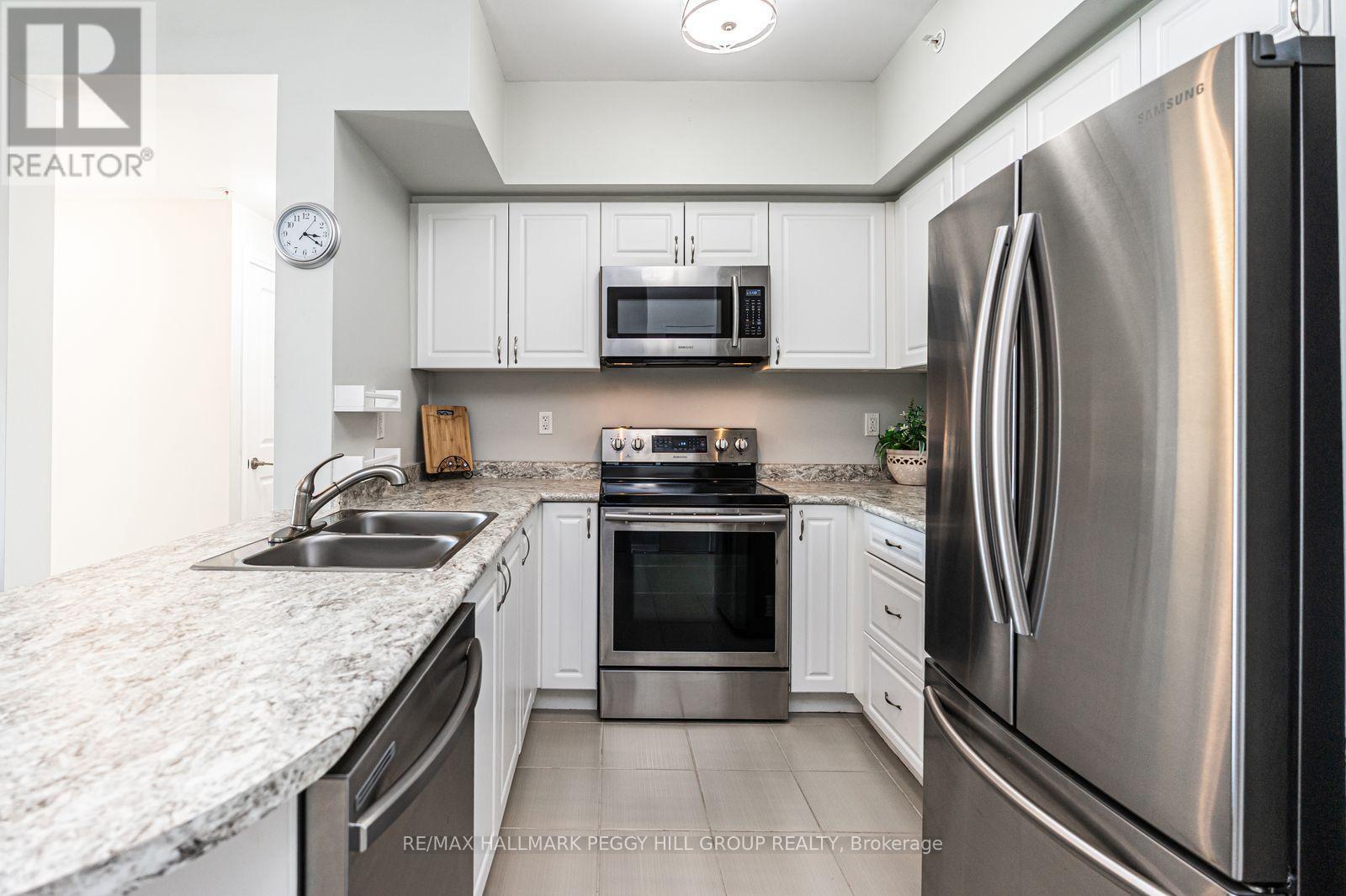 404 - 295 Cundles Road E, Barrie, ON - Indoor Photo Showing Kitchen With Stainless Steel Kitchen With Double Sink